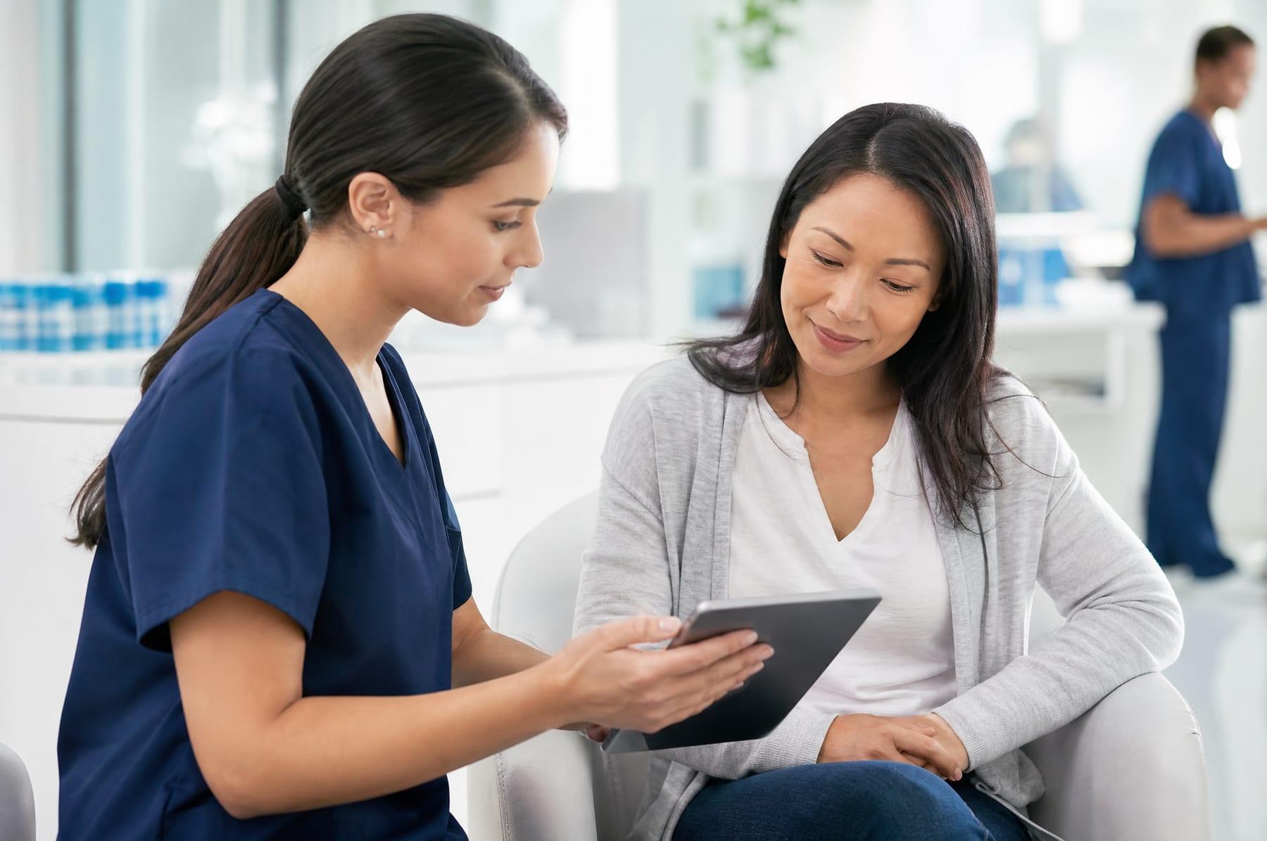 Clinical research coordinator reviewing a study with a patient participant